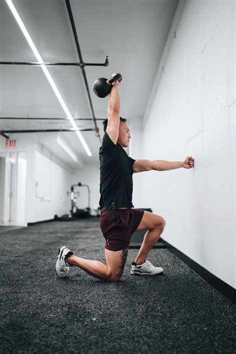 PR your kettlebell overhead press with this programming tip — Moment ...
