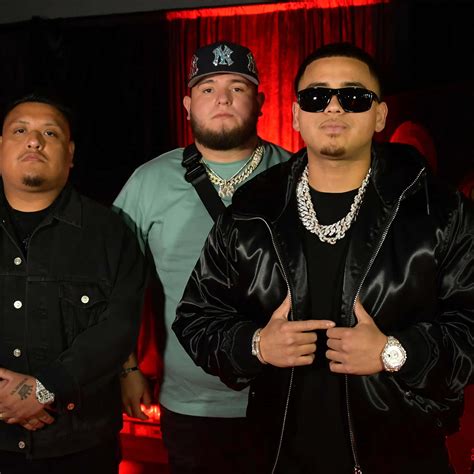 Download Fuerza Regida Members Posing Wallpaper | Wallpapers.com