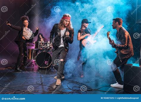 Singer with Rock and Roll Band Performing Music on Stage Stock Image ...