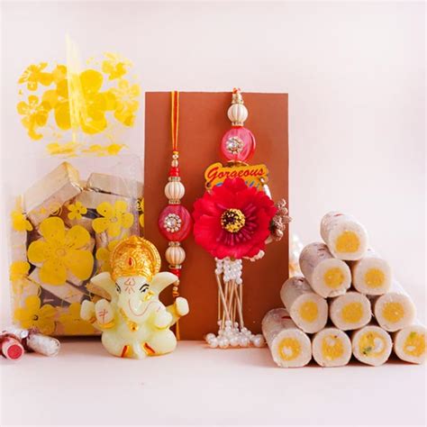 Send Delightful Bhaiya Bhabhi Rakhi Set with Ganesha Idol Online