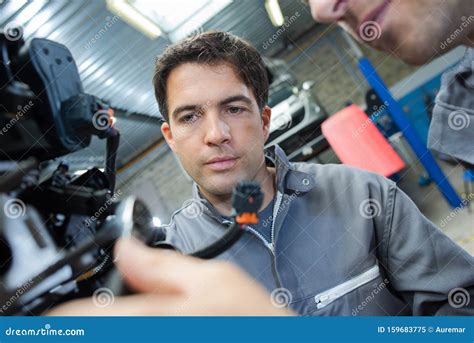 Image result for An Engineer Fixing Machine