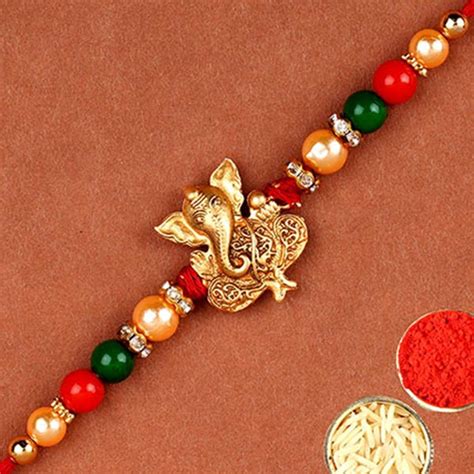 Send Golden Fancy Ganesha Rakhi Online