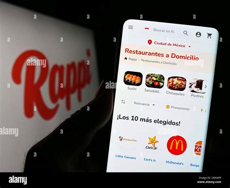 Stuttgart, Germany, 04-02-2023: Person holding smartphone with web page ...