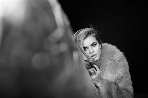 Stylish woman in fur coat sharp movement studio light | Premium Photo
