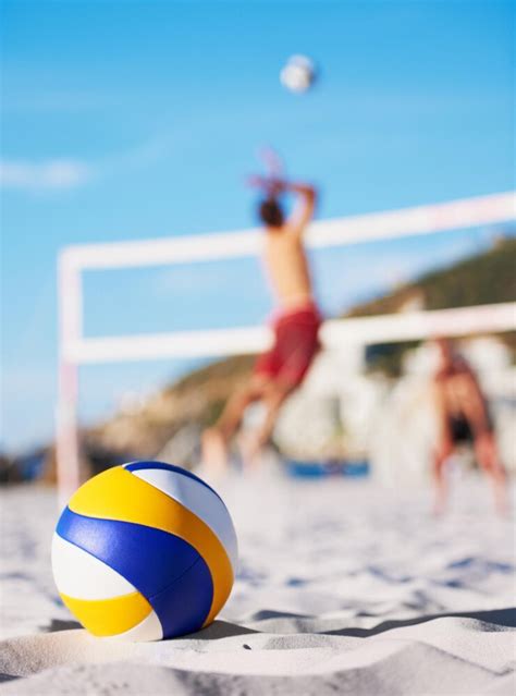 Beach floor sand and volleyball for sports game competition or outdoor ...