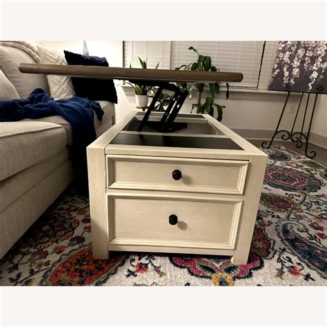 Ashley Furniture Bolanburg Lift Top Coffee Table - AptDeco