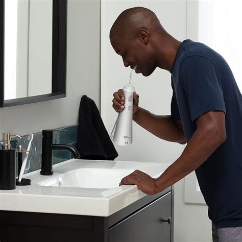 Buy Waterpik Cordless Plus Water Flosser with 4 Flossing Tips ...