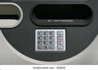 A man walks past an automated teller machine (ATM) outside Bank of America Corp. headquarters in Cha Vector Art