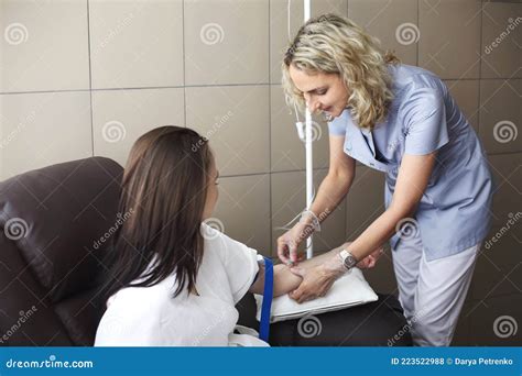 Doctor Cosmetologist Makes Cosmetology Dropper Procedure. Infusion. Young Woman in a Beauty ...