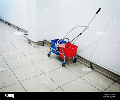 Industrial mop and bucket indoor Stock Photo - Alamy