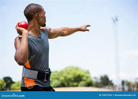 Male Athlete about To Throw Shot Put Ball Stock Photo - Image of ...