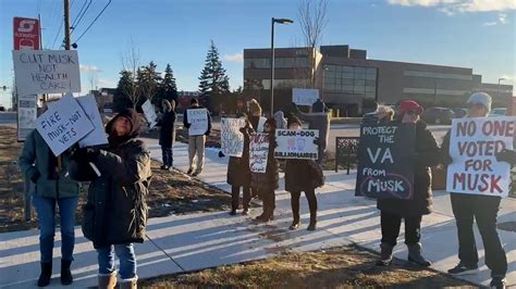 Anti-Musk protesters gather outside Tesla dealership in Michigan