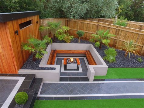 Modern fire pit with built in-seating and grey garden paving | Built in ...