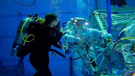 NASA astronaut surprised by wife during underwater training in Texas