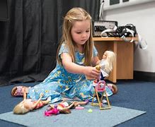 Image result for Playing with Barbie's for Kids