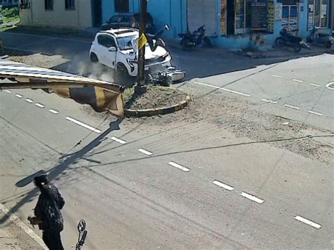 Biker thrown into air by car in KhandwaRolls 8 feet; suffers severe ...