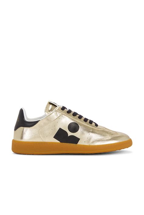 Isabel Marant ZAPATILLA DEPORTIVA KAYCEE en Light Gold & Black | FWRD