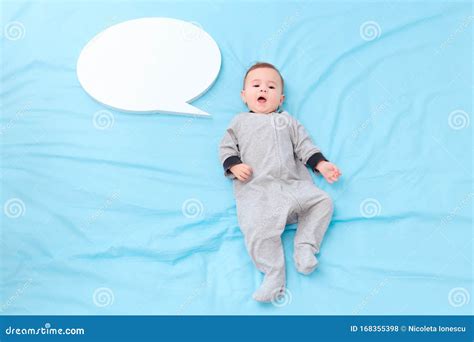 Happy Gurgling Baby Lying On His Bed Royalty-Free Stock Photo ...