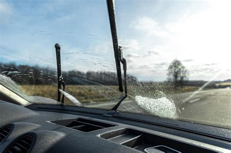 Car wipers clean windshields when driving in sunny weather | Premium Photo