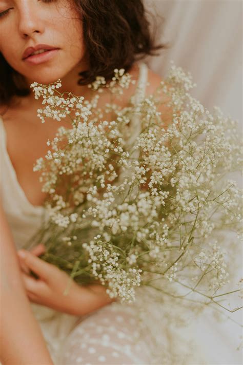 Woman in Blue Dress Walking Through Field of Angel Breath Flowers ...