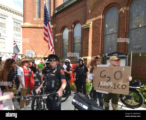 Raleigh Police form a barrier to protect two counter-protesters at the ...
