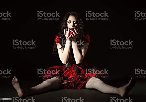 Strange Scary Girl With Mouth Sewn Shut Eating Nailed Apple Stock Photo ...