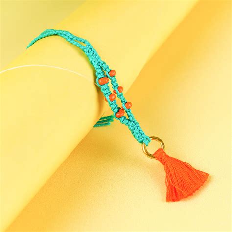 Buy Teal Macramé Cotton Rakhi With Orange Beads & Tassle Online On Zwende