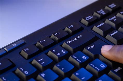 Premium Photo | Finger typing on a keyboard