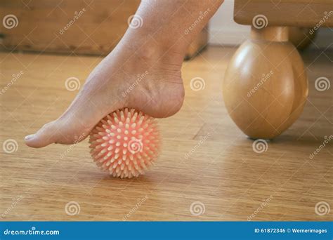 Foot with massage ball stock photo. Image of bedroom - 61872346