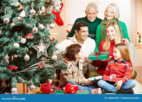 Family Giving Gifts at Christmas Stock Image - Image of people, gift ...