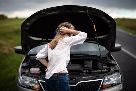 https://www.carparts.com/blog/wp-content/webp-express/webp-images/doc-root/wp-content/uploads/2021/10/woman-checking-car-engine-1024x683.jpg.webp