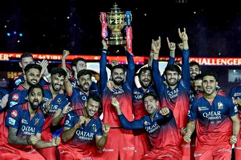 Virat Kohli, with the trophy in hand, celebrates RCB's IPL win with ...