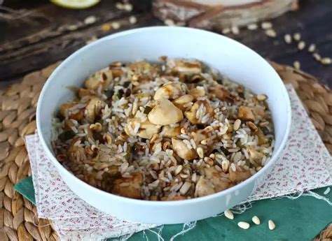Rice salad with chicken, zucchini, pine nuts and balsamic vinegar