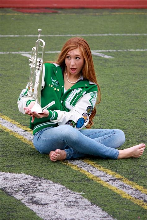 Senior Pictures with Letterman Jacket and Trumpet