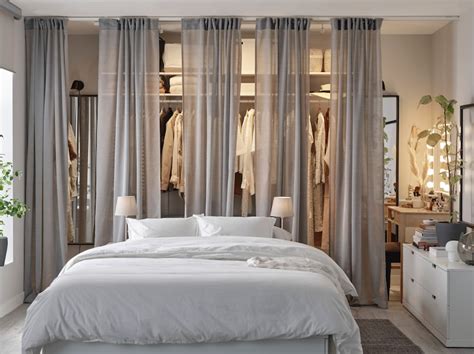 A bedroom with chic and accessible clothes storage - IKEA