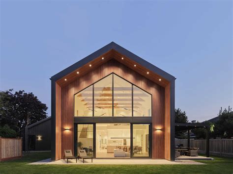 A Vaulted Ceiling Is A Dramatic Feature Inside This Modern Barn House ...