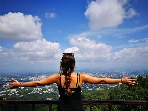 Rear view of friends standing on railing against sea | Premium Photo