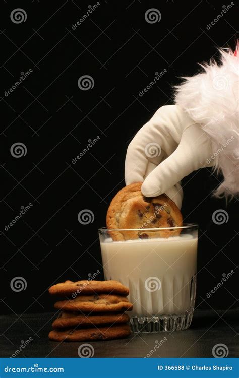 Santa Dips a Cookie in the Milk Stock Photo - Image of black, dessert ...