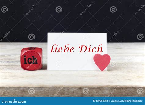 Valentine Greeting Card on Wooden Table with Text Ich Liebe Dich ...
