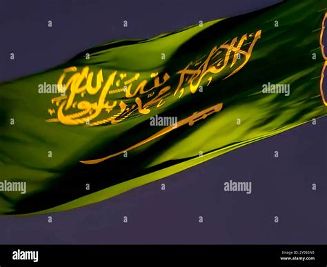 The national flag of Saudi Arabia kingdom, a green background with Arabic inscription and a ...
