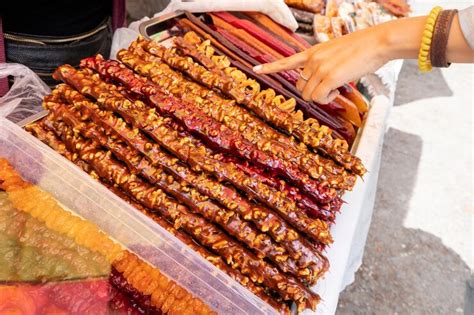 Woman chooses a churchkhela at a local georgian or armenian market this ...