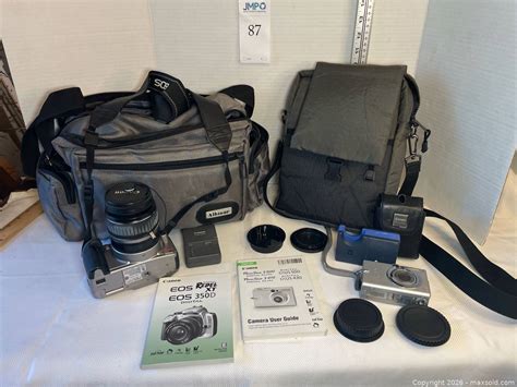 Canon EOS Rebel XT/350D DSLR, PowerShot camera, charger, manuals, lens ...