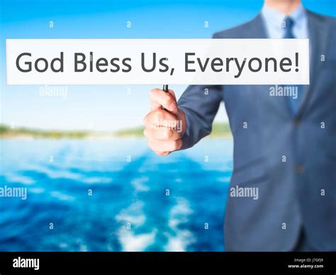 God Bless Us, Everyone - Businessman hand holding sign. Business ...
