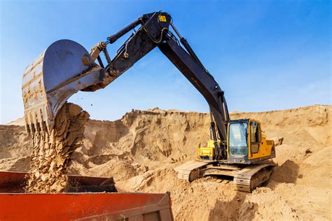 Image result for Large Excavators Loading Trucks