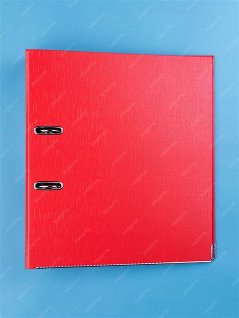 Red office folder on blue background office folder template | Premium Photo