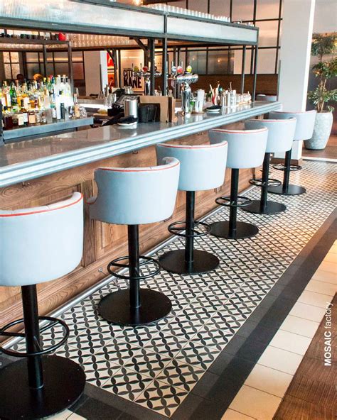 Restaurant bar floor with white, grey and black patterned terrazzo ...