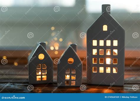 Small Candlestick Christmas Houses With Burning Candle Inside On ...