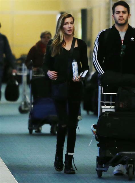 Katie Cassidy at Vancouver International Airport 2/16/ 2017 • CelebMafia