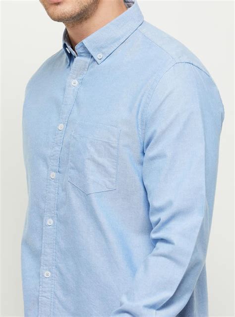 Buy Men Solid Slim Fit Casual Shirt Online at just Rs. 999.0 ...