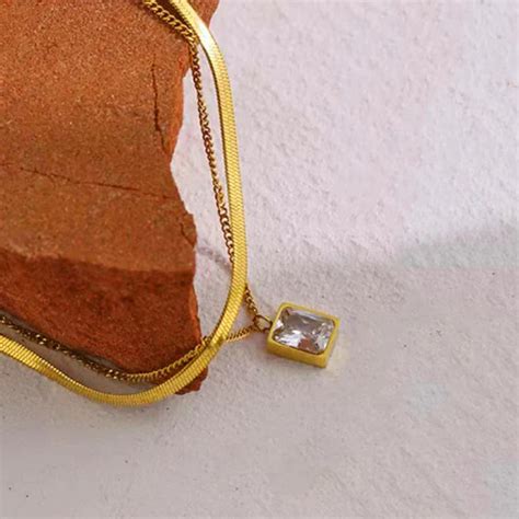 Elegant Layered Gold Necklace with Rectangular Crystal Pendant ...